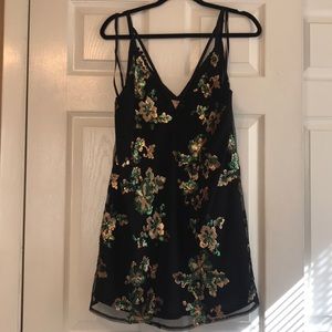 Short, flowy black and sequin dress